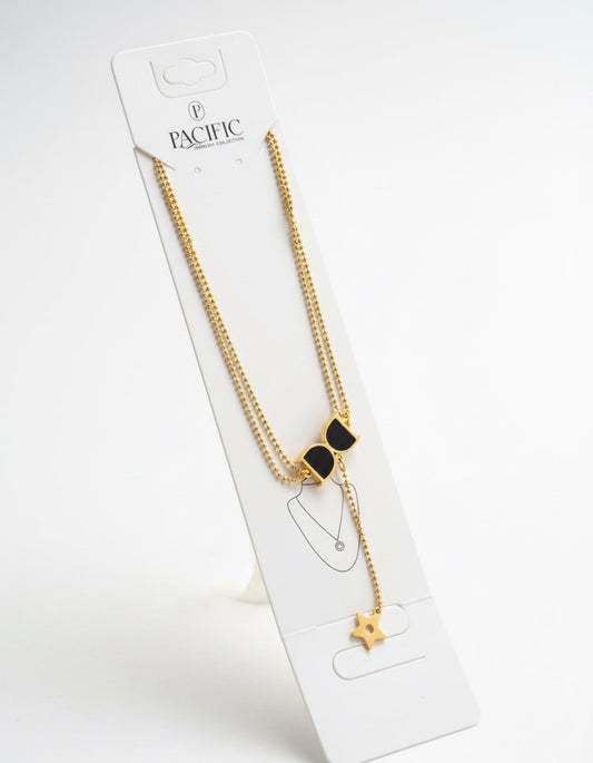 Gold necklace with black bow pendant on a white Pacific branded card